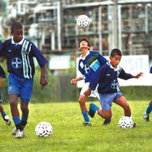 boys playing soccer sports